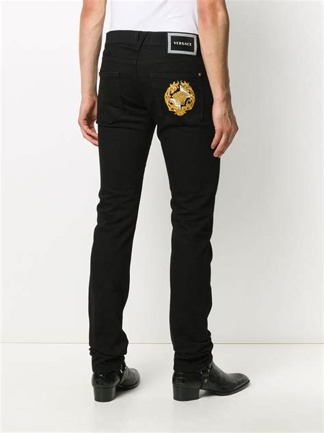 versace mens pantsuit|Versace denim pants.